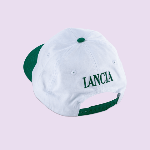 The back of Amigos Tequila Flavoured Beer cap, the cap is green and white with the text "Lancia" on the back. 