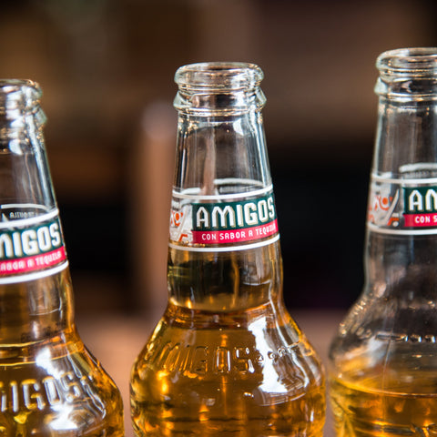 The bottleneck of a bottle of Amigos Tequila Flavoured Beer