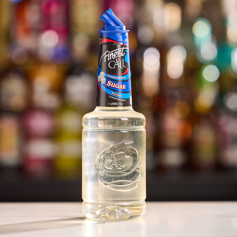 A bottle of Finest Call Premium Sugar Syrup, a non-alcoholic syrup, perfect for mixing cocktails and mocktails. 