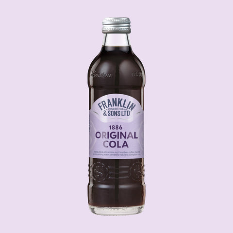 A glass bottle of Franklin & Sons 1886 Original Cola, a premium soft drink. 