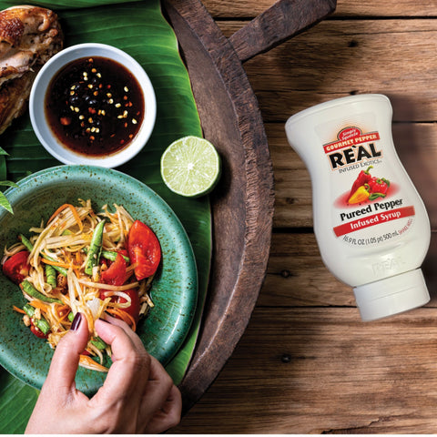 Someone eating, and a sauce that has been made using Real gourmet pepper infused syrup, a vegan and gluten-free syrup. 