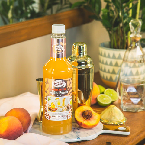 A bottle of Master of Mixes White Peach cocktail mixer, a non-alcoholic cocktail and mocktail mixer. 