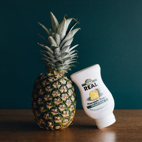 A bottle of Reál Pineapple Puree Infused Syrup. 