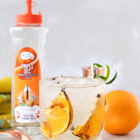 A cocktail made with Master of mixes cocktail essentials triple sec syrup, perfect for making cocktails and mocktails. 