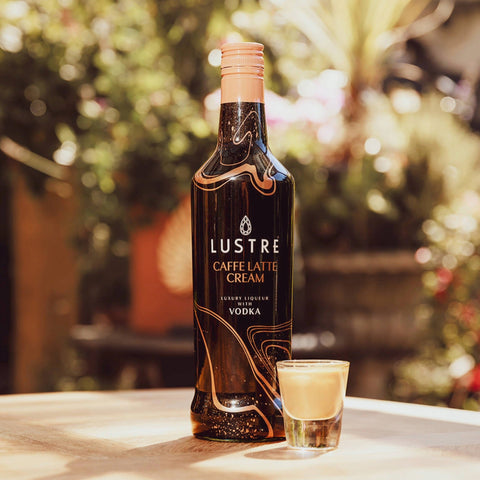 A bottle of Lustre Caffe Latte Vodka Cream Liqueur, a vegan cream liqueur.