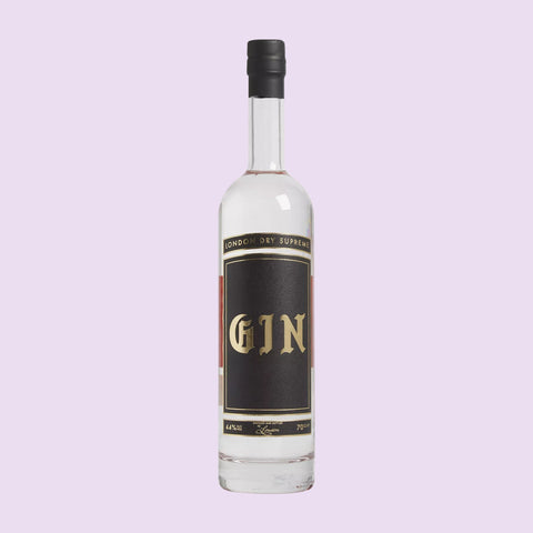 A bottle of Goldy Gin London Dry Supreme Gin with a white label and black text, great to make a gin and tonic with. 
