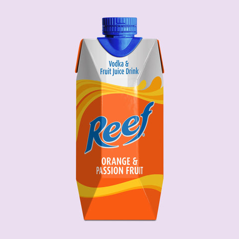 Reef orange and passion fruit juice drink carton on a light purple background